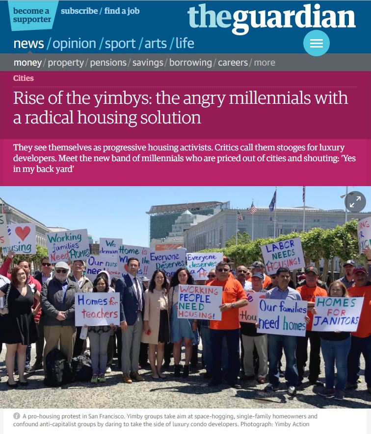 Image from The Guardian article showing people protesting for more housing